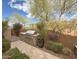 Backyard boasts a built-in grill, landscaped yard and patio at 18515 N 94Th St, Scottsdale, AZ 85255