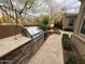 Outdoor kitchen features a built-in grill and ample counter space for entertaining at 18515 N 94Th St, Scottsdale, AZ 85255