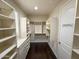 Walk-in closet offering built-in storage solutions, including shelving and drawer units at 18515 N 94Th St, Scottsdale, AZ 85255