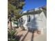 Charming mobile home exterior with desert landscaping, potted plants, and blue skies at 201 S Greenfield Rd # 331, Mesa, AZ 85206