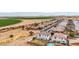 Wide aerial showing community next to a vibrant green field at 20358 N Valencia N Dr, Maricopa, AZ 85138