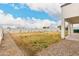 Large backyard with gravel and lawn, offering ample outdoor space for recreation and landscaping at 20358 N Valencia N Dr, Maricopa, AZ 85138
