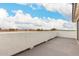 Expansive balcony with white stucco and stunning views of the surrounding landscape and clear blue sky at 20358 N Valencia N Dr, Maricopa, AZ 85138