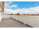 Spacious balcony offers scenic neighborhood views and room for outdoor seating under a bright sky at 20358 N Valencia N Dr, Maricopa, AZ 85138