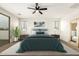 Staged bedroom featuring wood floors, a ceiling fan, and balcony view at 20358 N Valencia N Dr, Maricopa, AZ 85138