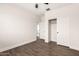 This bedroom features hardwood floors, ample closet space, and neutral paint at 20358 N Valencia N Dr, Maricopa, AZ 85138