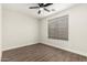 A bright bedroom features a large window with natural light and hardwood flooring at 20358 N Valencia N Dr, Maricopa, AZ 85138