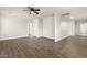 A spacious bedroom is brightened by neutral walls and flooring under a ceiling fan at 20358 N Valencia N Dr, Maricopa, AZ 85138