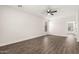 A spacious bedroom is brightened by neutral walls and flooring under a ceiling fan at 20358 N Valencia N Dr, Maricopa, AZ 85138