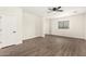 A bright bedroom features a large window with natural light and hardwood flooring at 20358 N Valencia N Dr, Maricopa, AZ 85138