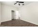 This bedroom features hardwood floors, ample closet space, and neutral paint at 20358 N Valencia N Dr, Maricopa, AZ 85138