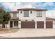 Two-story home featuring a three-car garage, tile roof, and modern design at 20358 N Valencia N Dr, Maricopa, AZ 85138