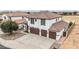 Beautiful two-story home with a three-car garage and well-maintained landscaping at 20358 N Valencia N Dr, Maricopa, AZ 85138
