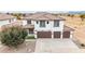 Attractive two-story home with a three-car garage and tile roof at 20358 N Valencia N Dr, Maricopa, AZ 85138