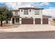 Two-story home featuring a three-car garage, tile roof, and modern design at 20358 N Valencia N Dr, Maricopa, AZ 85138