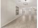Spacious living room with tile flooring, recessed lighting, and plenty of windows at 20358 N Valencia N Dr, Maricopa, AZ 85138