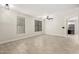 Bright living room with tile floors, recessed lights, and lots of natural light at 20358 N Valencia N Dr, Maricopa, AZ 85138