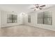 Bright living room with tile floors, recessed lights, and lots of natural light at 20358 N Valencia N Dr, Maricopa, AZ 85138