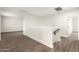 An open concept loft is brightened by neutral walls and flooring at 20358 N Valencia N Dr, Maricopa, AZ 85138
