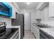 Bright kitchen features stainless steel appliances, granite countertops, and tile flooring at 2220 W Dora St # 129, Mesa, AZ 85201