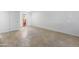Bright, open living space with neutral tile flooring and natural light from sliding glass doors at 2220 W Dora St # 129, Mesa, AZ 85201