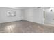 Bright living space with tile floors, a window with blinds, and access to other rooms at 2220 W Dora St # 129, Mesa, AZ 85201