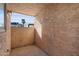 Small outdoor patio featuring stucco walls and concrete flooring at 2220 W Dora St # 129, Mesa, AZ 85201