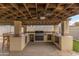 Spacious outdoor kitchen area featuring a built-in grill, countertop space, and ample storage at 2220 W Surrey Ave, Phoenix, AZ 85029