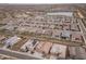 High-angle aerial view of a large planned community, complete with a lake and clubhouse in the distance at 24757 N 175 Dr, Surprise, AZ 85387
