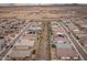 Wide aerial view of a meticulously planned community showcasing modern homes, streets, and open spaces in a desert setting at 24757 N 175 Dr, Surprise, AZ 85387