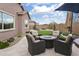 Backyard seating area with gas firepit for cozy gatherings and outdoor relaxation at 24757 N 175 Dr, Surprise, AZ 85387