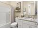 Cozy bathroom showcasing a shower-tub combination, toilet, vanity, and granite countertop sink at 24757 N 175 Dr, Surprise, AZ 85387