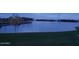 Evening view of the community lake featuring fountains, community center and a relaxing atmosphere at 24757 N 175 Dr, Surprise, AZ 85387