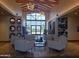 An elegant lobby featuring comfortable seating, chic decor, and bright natural light at 24757 N 175 Dr, Surprise, AZ 85387