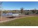 A scenic park with benches and a beautiful view of the lake, perfect for relaxation and enjoying the outdoors at 24757 N 175 Dr, Surprise, AZ 85387