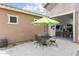 Outdoor patio with table, chairs, and backyard access through converted garage door at 24757 N 175 Dr, Surprise, AZ 85387