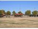 Playground with shaded structures, play equipment and a soccer field offering a space for Gathering fun and recreation at 24757 N 175 Dr, Surprise, AZ 85387