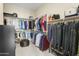 Spacious walk-in closet with custom shelving and hanging racks for optimal organization at 24757 N 175 Dr, Surprise, AZ 85387