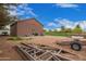 Exterior view of a versatile auxiliary building featuring a private yard with room for vehicles and storage at 25817 S Mandarin Dr, Queen Creek, AZ 85142