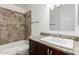 Bathroom showcasing a tiled shower and vanity with granite countertop, combining functionality with style at 2875 W Highland St # 1213, Chandler, AZ 85224