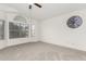 Bright bedroom with large windows offering natural light and neighborhood views, complemented by neutral carpeting at 2875 W Highland St # 1213, Chandler, AZ 85224