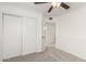Bedroom featuring a closet with sliding doors and adjacent open doorway, perfect for versatile room use at 2875 W Highland St # 1213, Chandler, AZ 85224