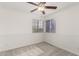 Cozy bedroom featuring white wainscoting, crown molding, and a ceiling fan for added comfort at 2875 W Highland St # 1213, Chandler, AZ 85224