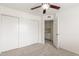 This bedroom features a closet with sliding doors and an open door to a well-lit adjoining room at 2875 W Highland St # 1213, Chandler, AZ 85224