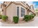 Attractive exterior view of a two-story townhome with desert landscaping and sidewalk at 2875 W Highland St # 1213, Chandler, AZ 85224