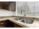 Detailed view of a kitchen sink with granite countertops and modern fixtures at 2875 W Highland St # 1213, Chandler, AZ 85224