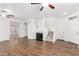 Bright living room with hardwood floors, a fireplace, and a staircase at 2875 W Highland St # 1213, Chandler, AZ 85224