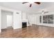 Open-concept living area featuring hardwood floors, a fireplace, and ample natural light at 2875 W Highland St # 1213, Chandler, AZ 85224