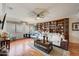 Cozy living room with hardwood flooring, and a built in bookcase at 3134 N 145Th Ave, Goodyear, AZ 85395