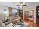 Comfortable living room with hardwood floors, a ceiling fan and a large window at 3134 N 145Th Ave, Goodyear, AZ 85395